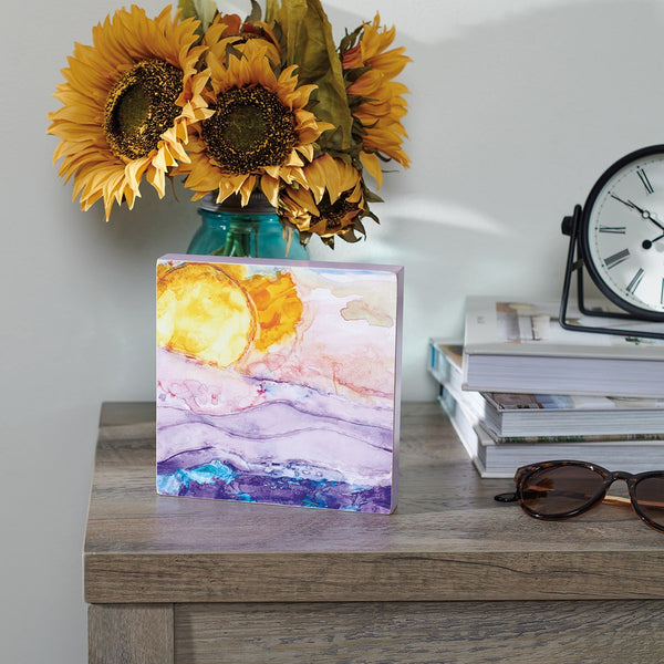 Brighten the room with this shining wooden block sign displaying original artwork from our Artist Collective Collection focused on inspiration of the sun