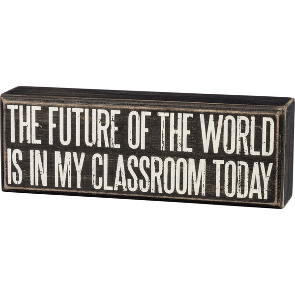 A classic black and white wooden box sign featuring a distressed "The Future Of The World Is In My Classroom Today" sentiment